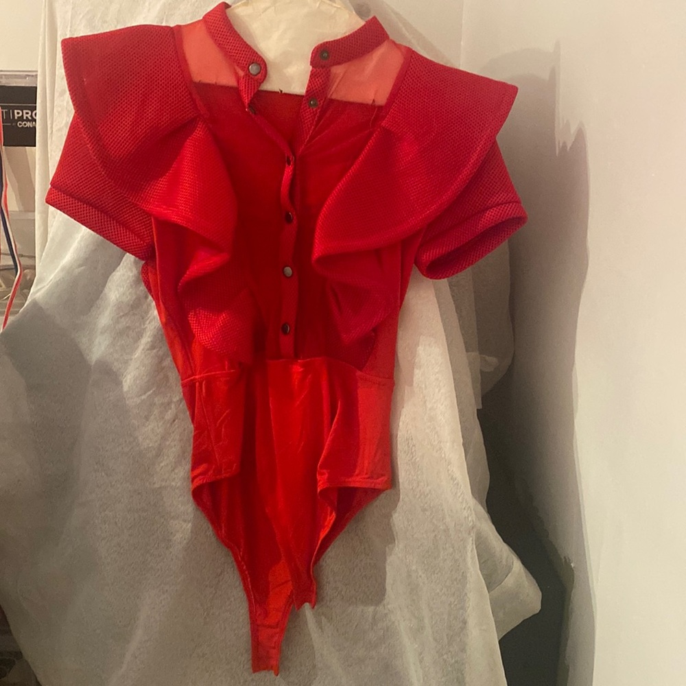 Red mesh body suit.